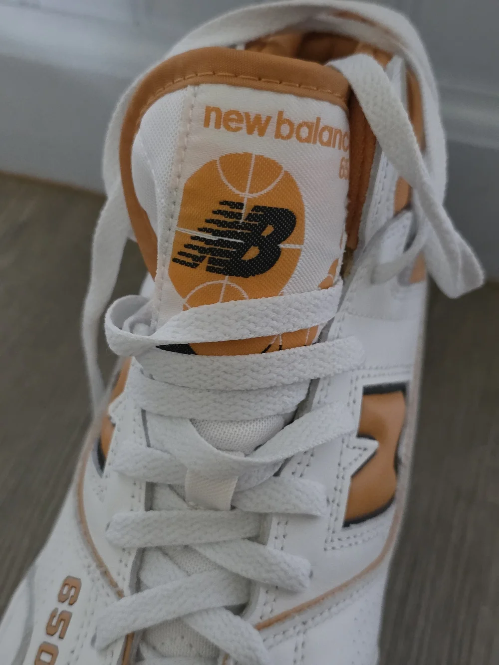 New Balance White and Orange Mid-Top Athletic Sneakers